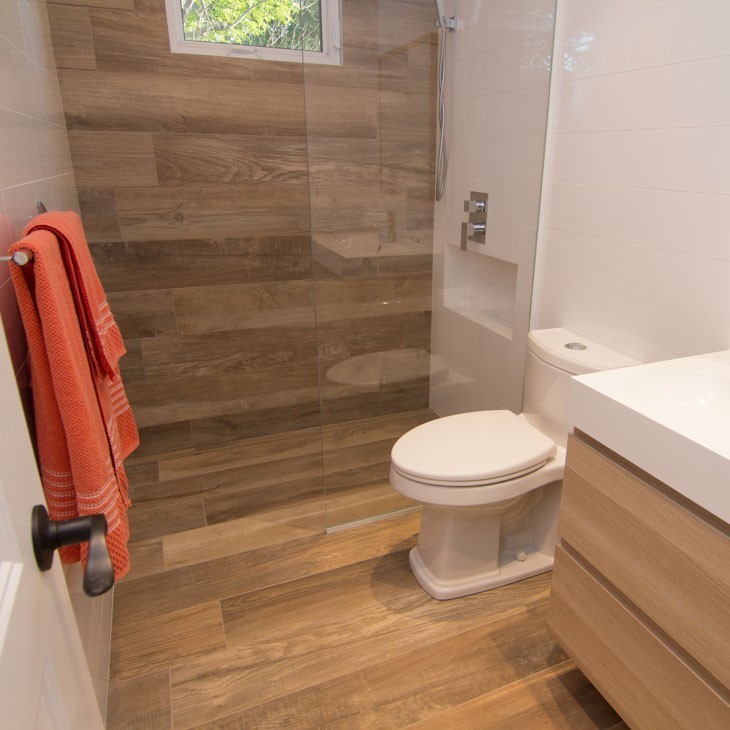 waterproof Hot Press Tiles LVT on the floor and wall in bathroom.jpg